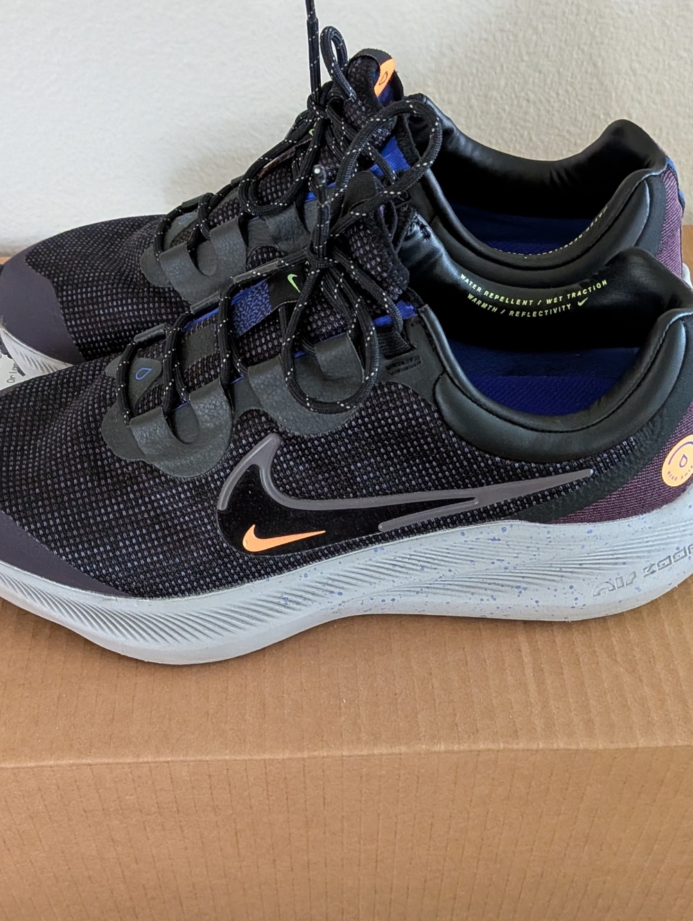 Nike Women's Black/Purple Running Shoes with Orange Accents
